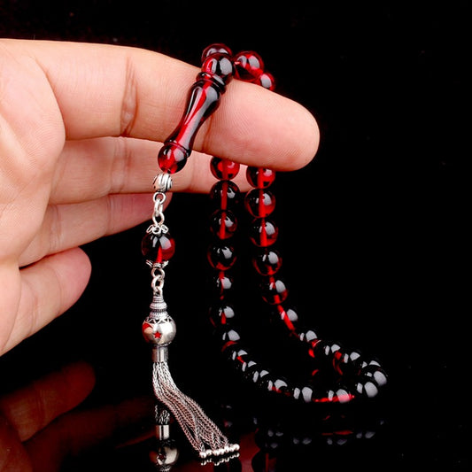 Gebetskette aus Feuerbernstein mit rot emaillierter Silberquaste