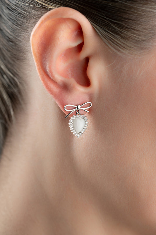 Silver color earrings with heart stone