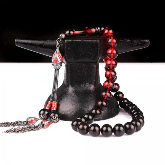 Gebetskette aus Feuerbernstein mit rot emaillierter Silberquaste