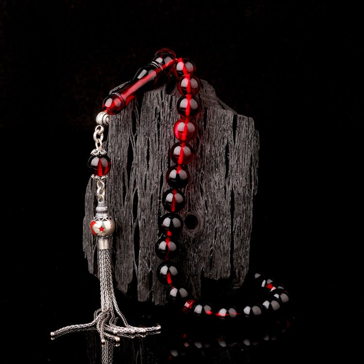 Gebetskette aus Feuerbernstein mit rot emaillierter Silberquaste