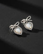 Silver color earrings with heart stone