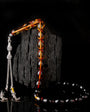 Strained squeezing amber letters silver fragmented rosary