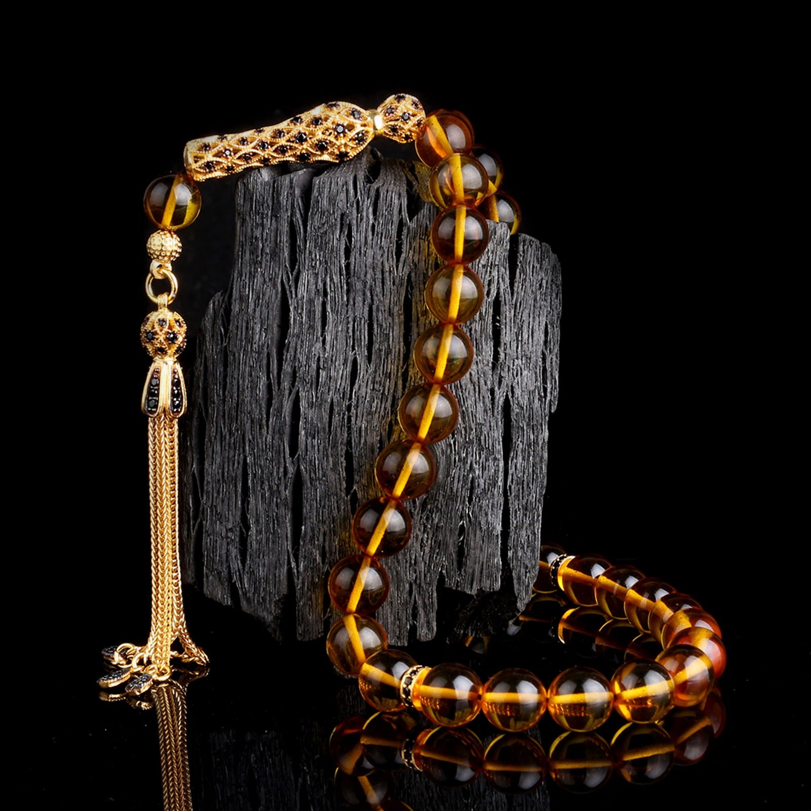Globe cut black zircon stone fire amber rosary
